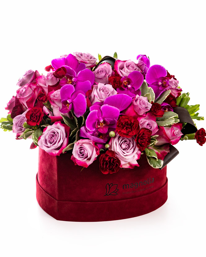 Orchids and roses in heart box