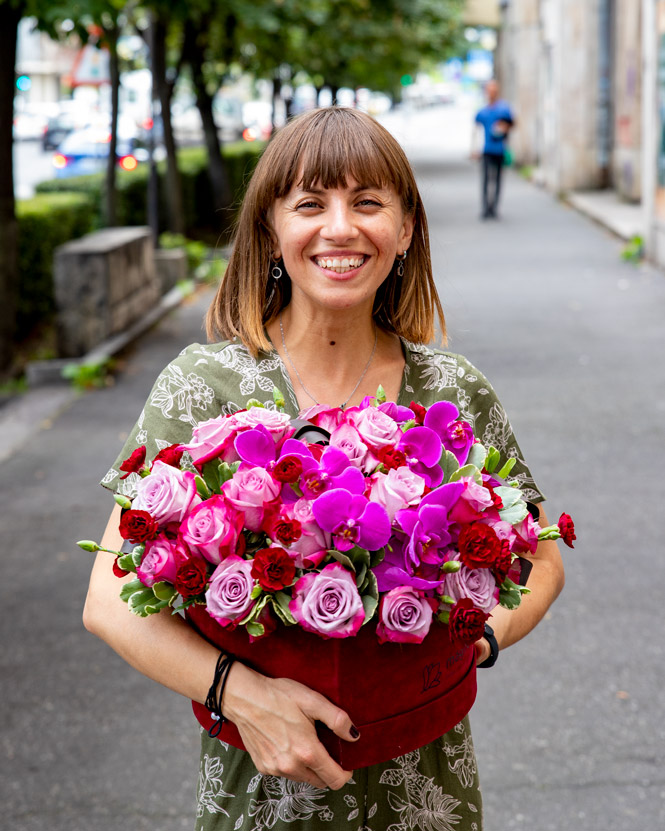 Orchids and roses in heart box