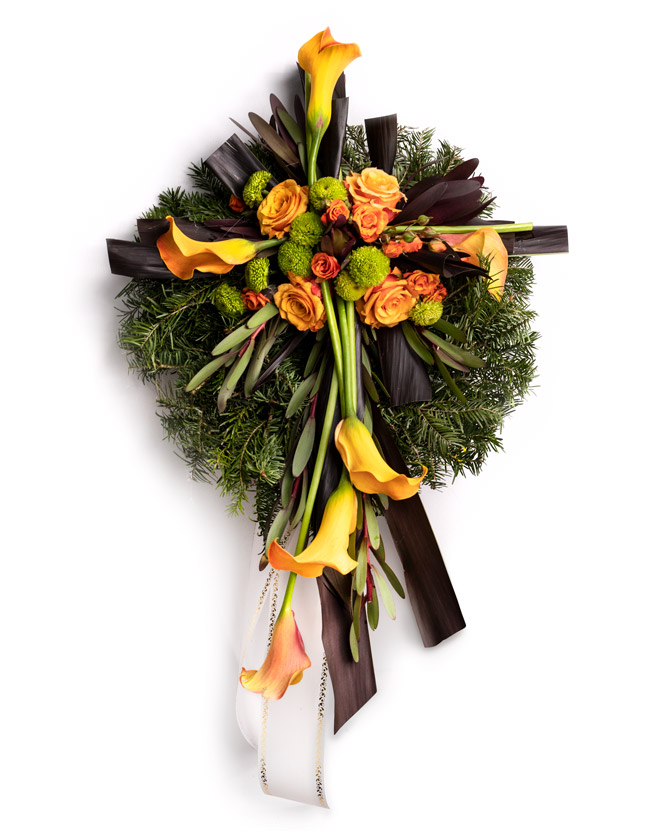 Funeral wreath with orange roses and callas