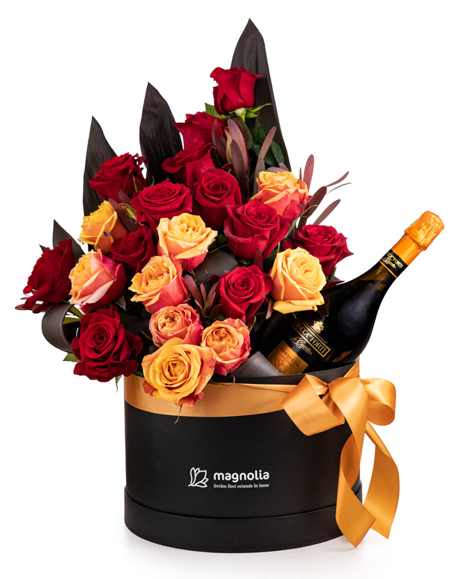 Arrangement with roses and sparkling wine