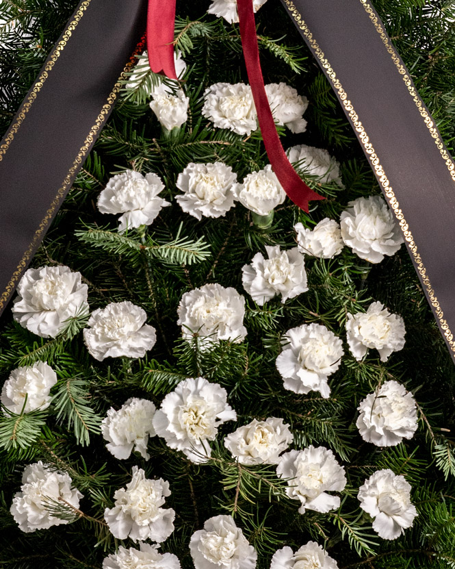 Funeral spray with white carnations