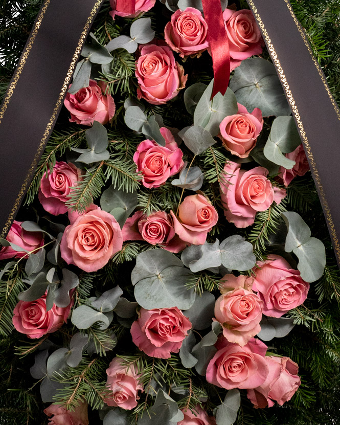 Funeral spray with pink roses