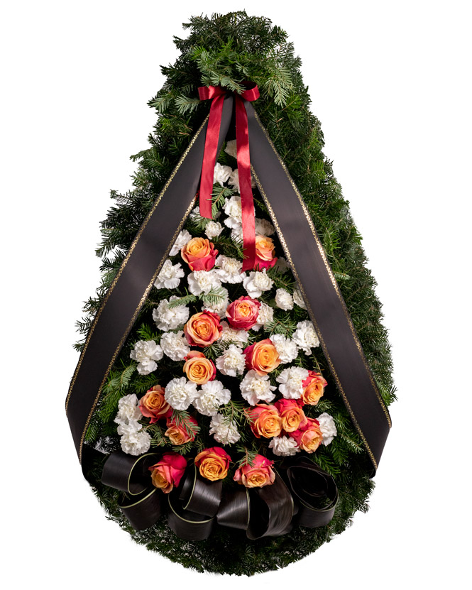 Funeral spray with carnations and orange roses