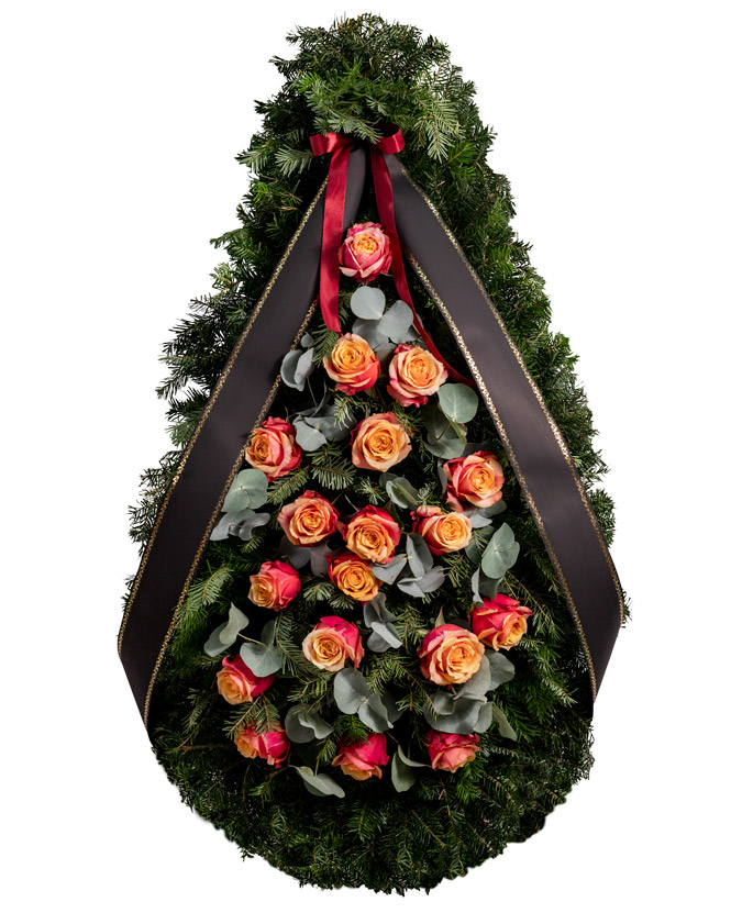 Funeral spray with orange roses