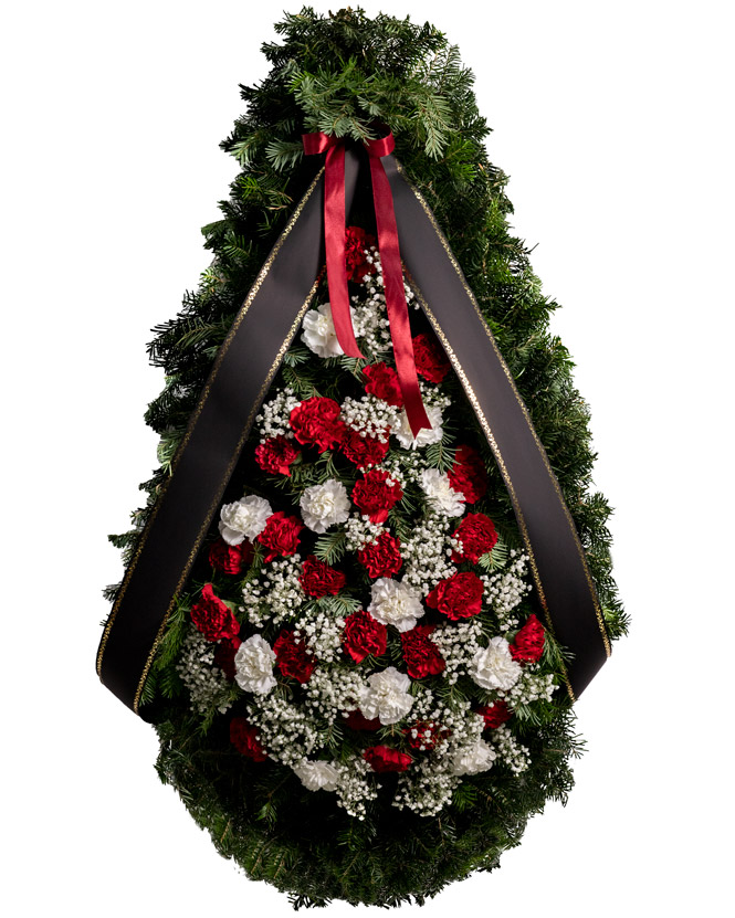 Funeral spray with white and red carnations