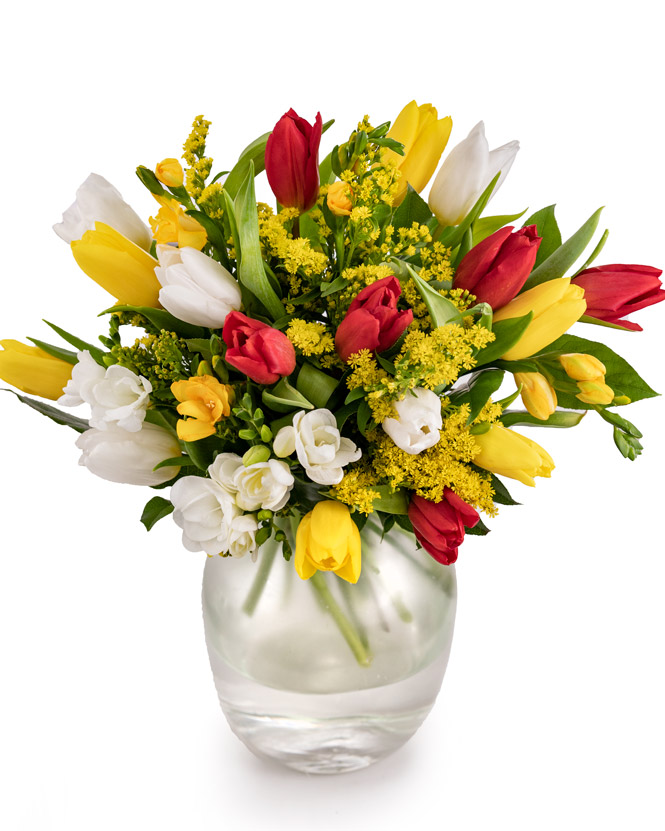 Bouquet with multicolored freesias, tulips and greenery