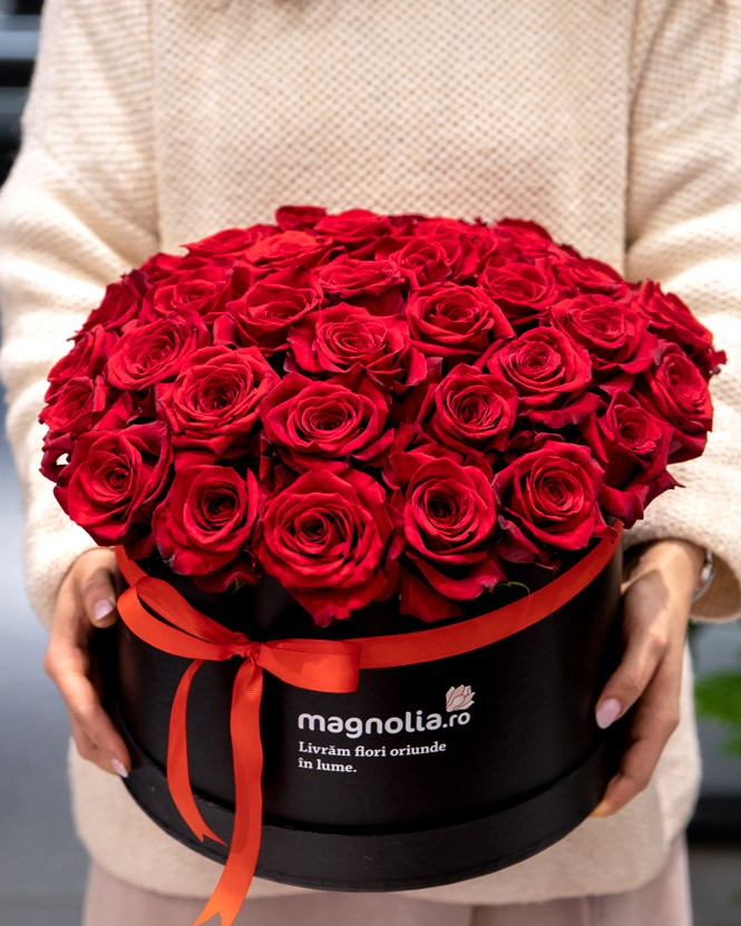 Arrangement in box with red roses