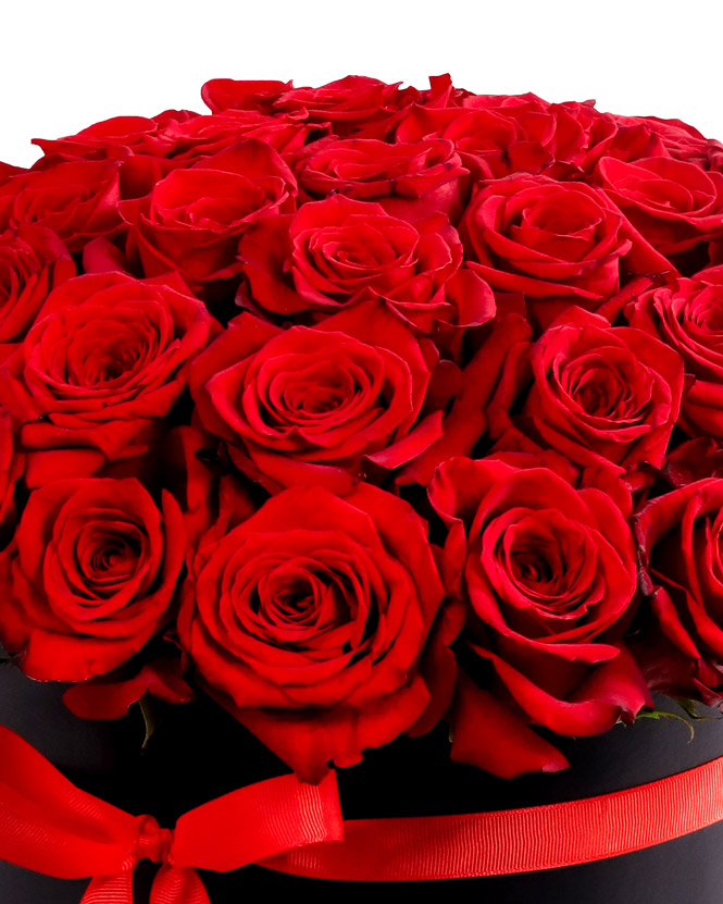 Arrangement in box with red roses