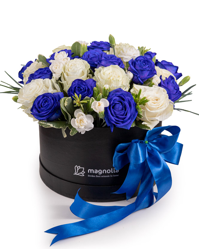 Arrangement with blue and white roses