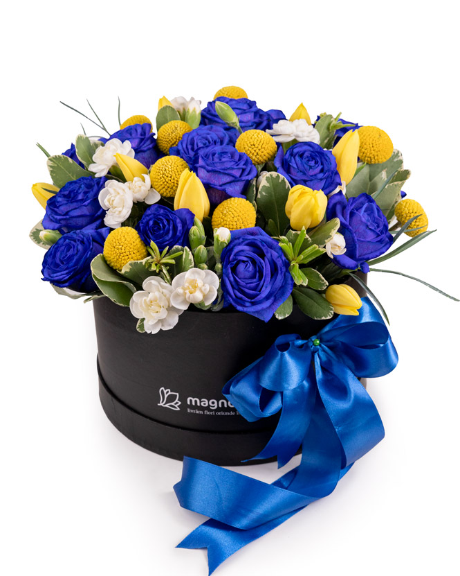 Arrangement with blue roses, tulips and craspedia