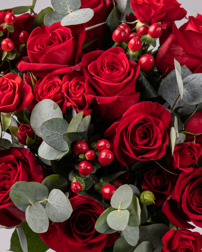 Bouquet with red roses and greenery