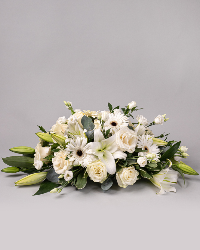 Funeral arrangement of white flowers