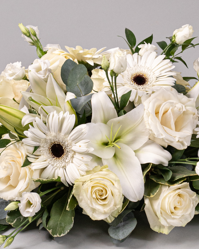 Funeral arrangement of white flowers