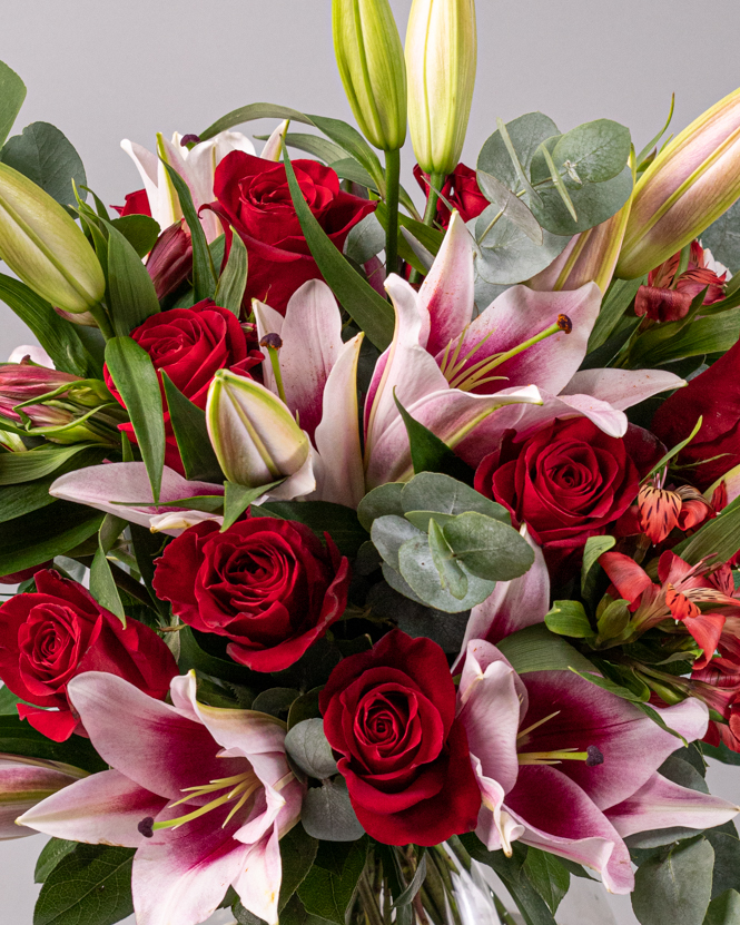 Bouquet of red roses and lilies