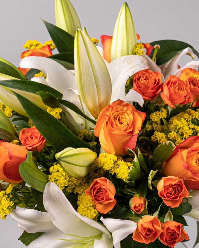 Bouquet of orange roses and lilies