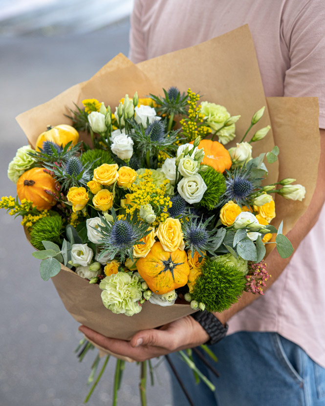 Roses, eustoma and ornamental pumpkins bouquet