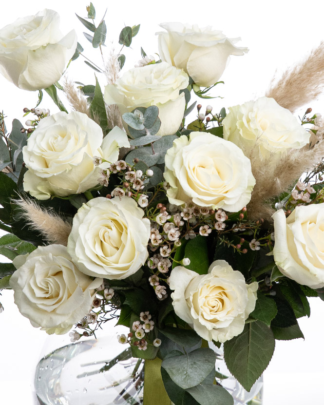 White roses bouquet decorated with pampas grass