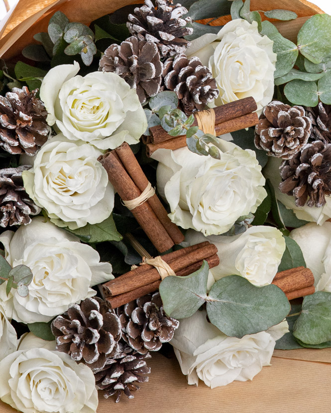 Christmas gift with white roses and chocolate