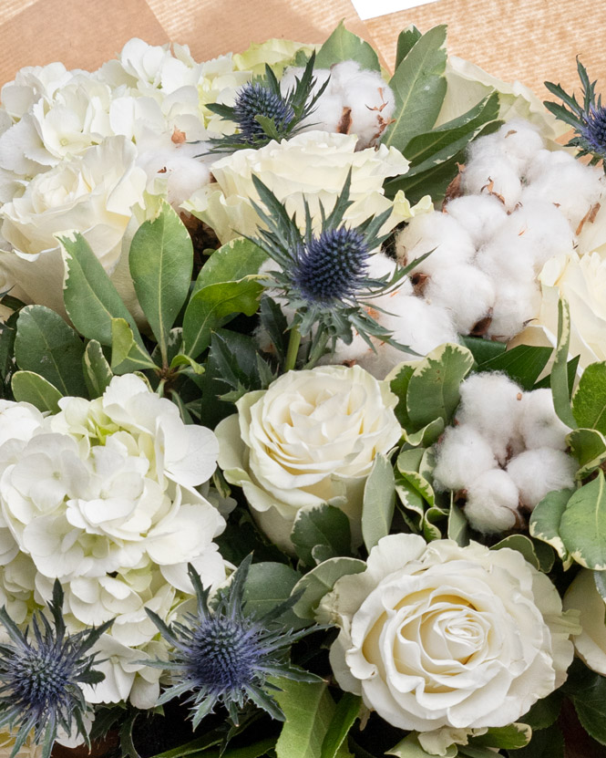 White roses bouquet with cotton