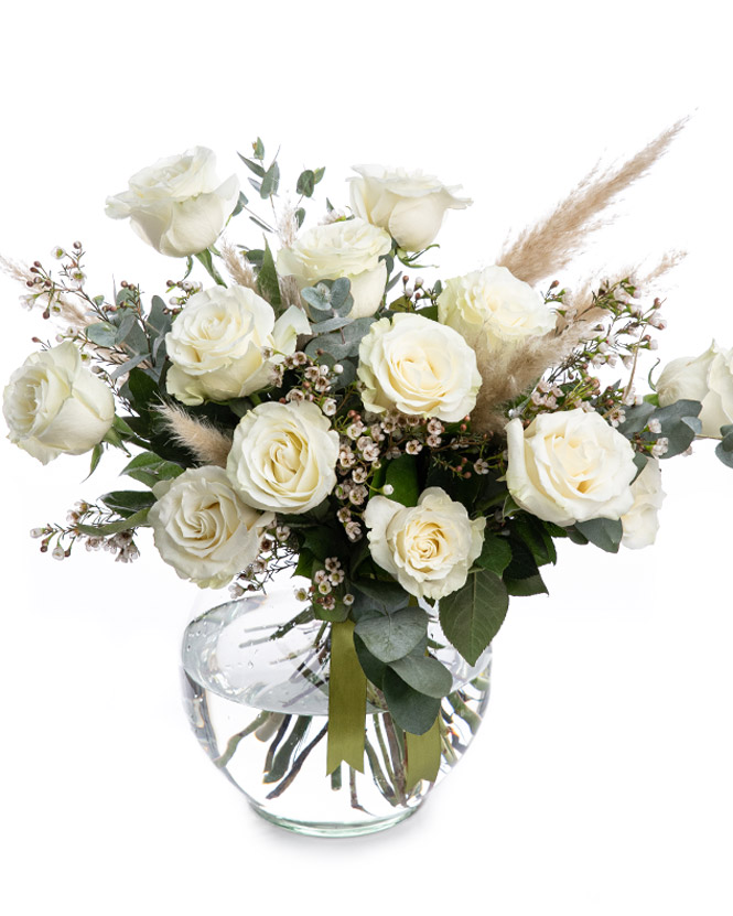 White roses bouquet decorated with pampas grass