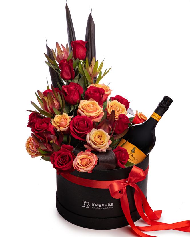 Arrangement with roses and sparkling wine