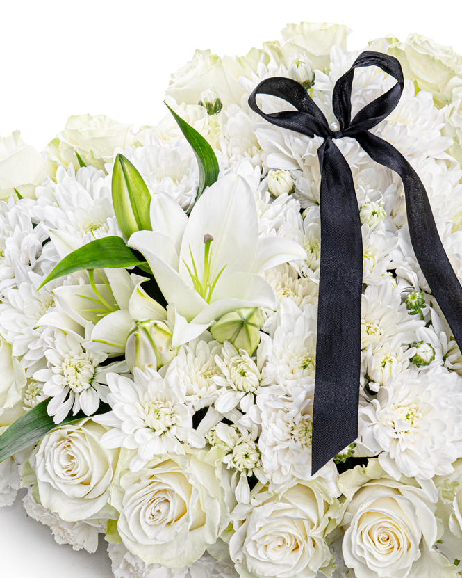 Floral funeral heart with white roses and chrisanthemums
