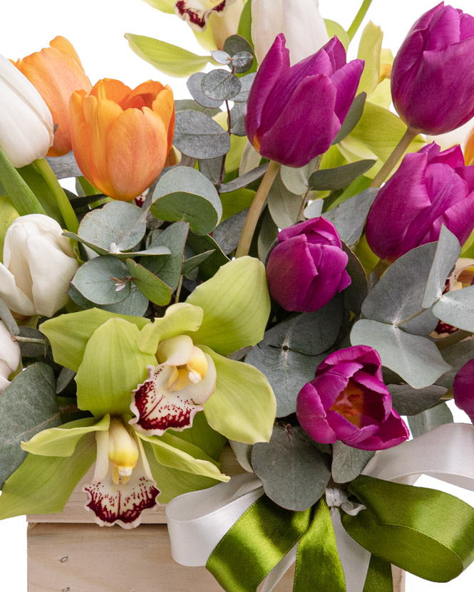 Floral arrangement with tulips and orchid