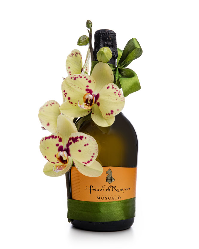 Prosecco bottle with orchids