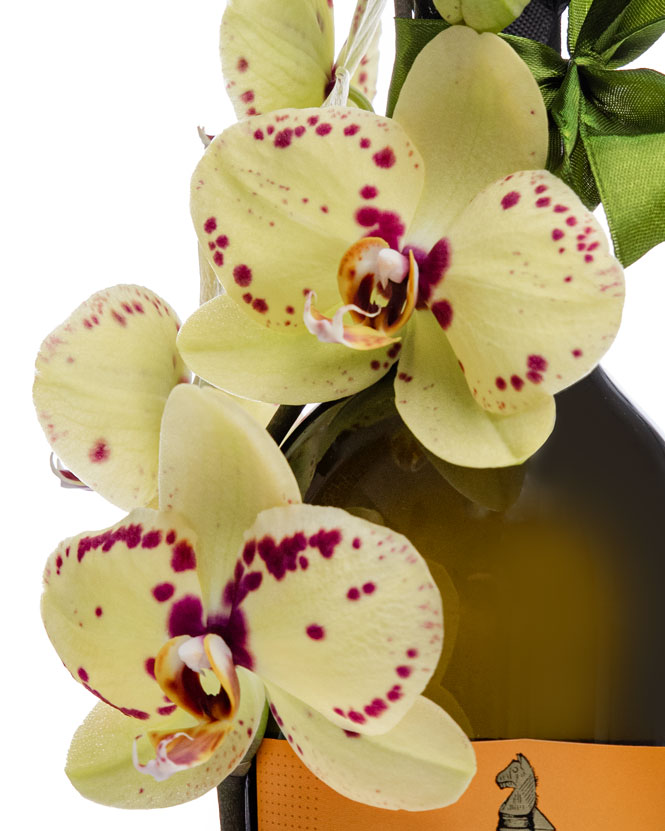 Prosecco bottle with orchids