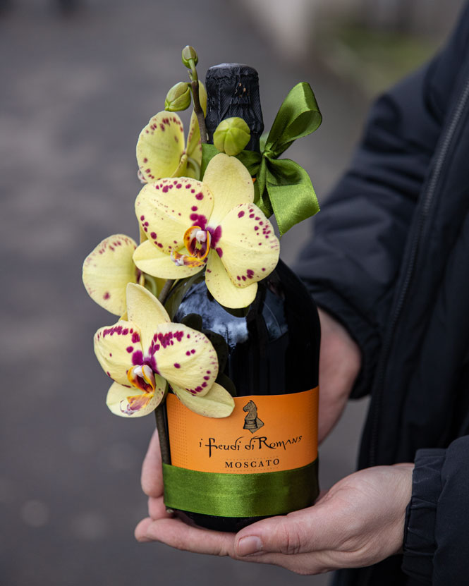 Prosecco bottle with orchids