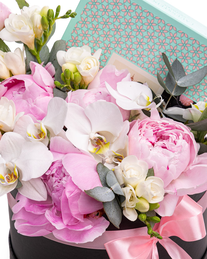 Arrangement with peonies, orchids and chocolate