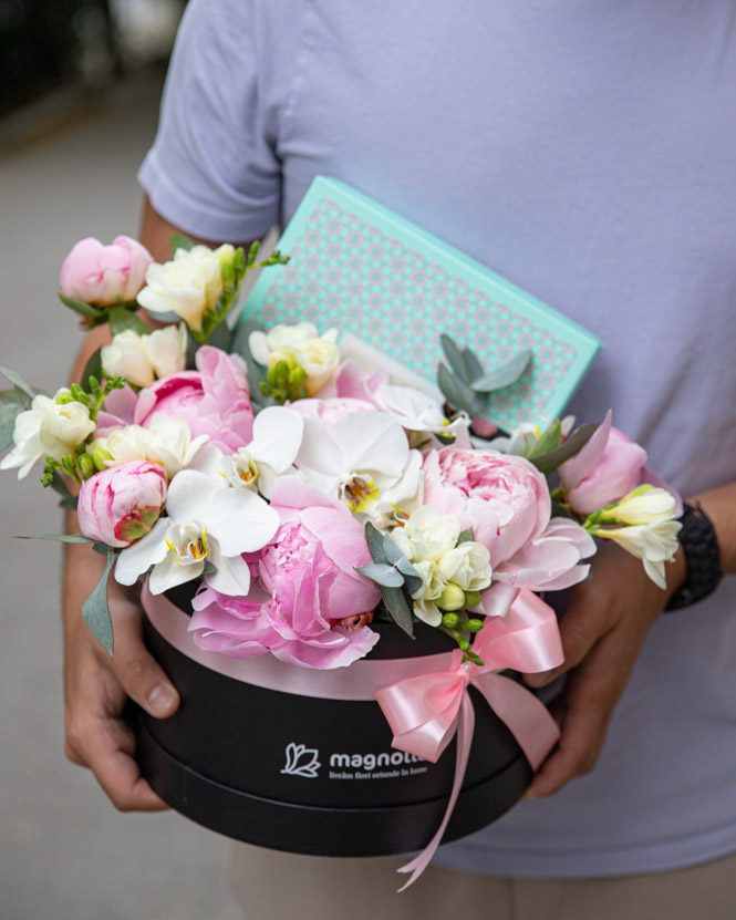 Arrangement with peonies, orchids and chocolate