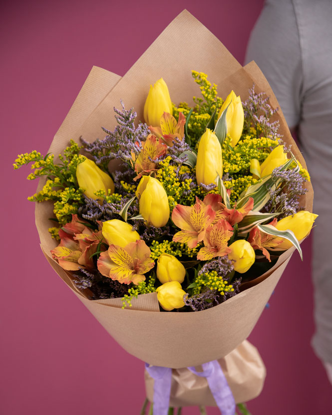 Cheerful bouquet with yellow tulips