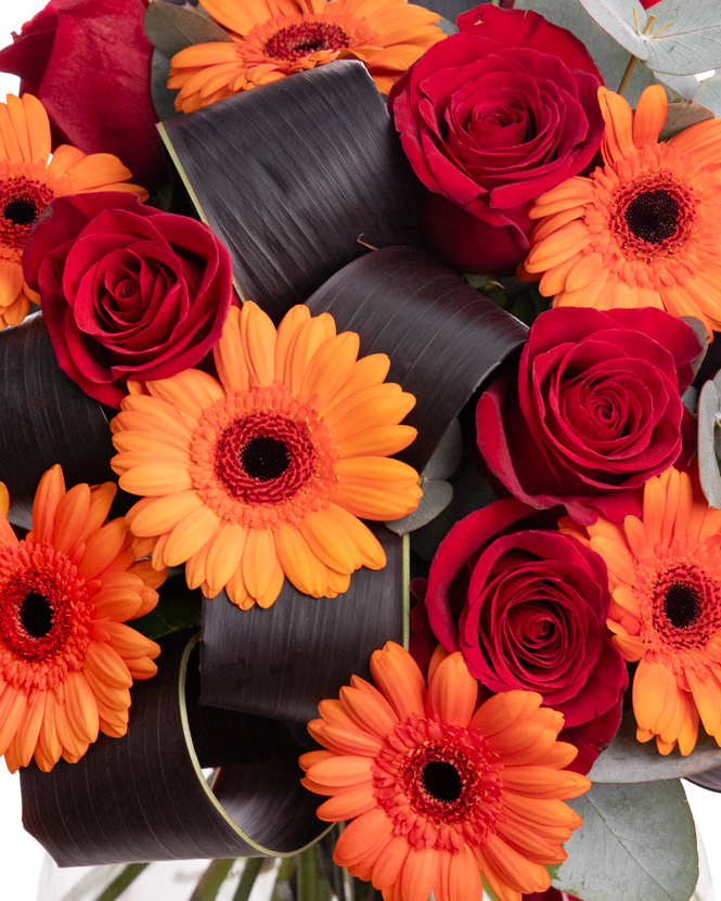 Bouquet with red roses and orange gerberas