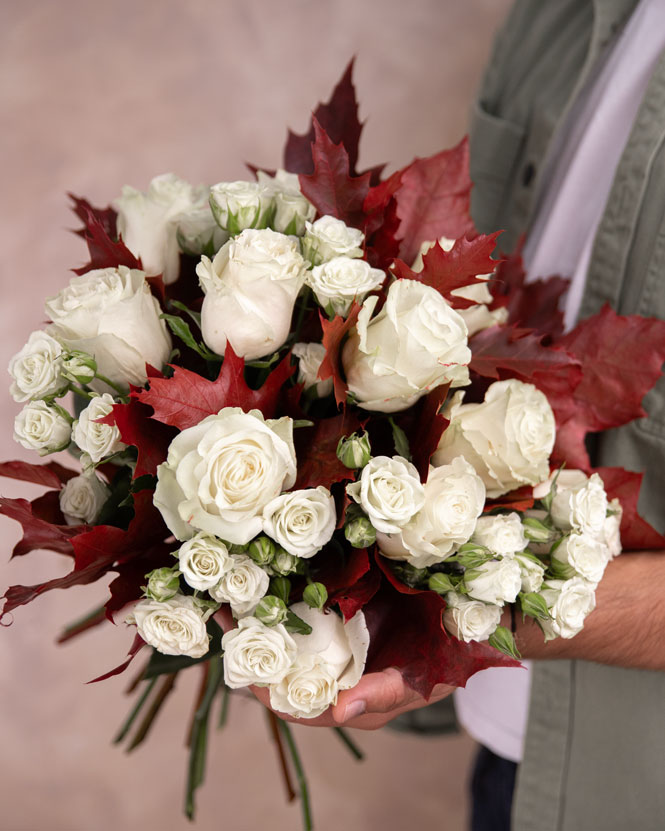 Autumn bouquet with white roses