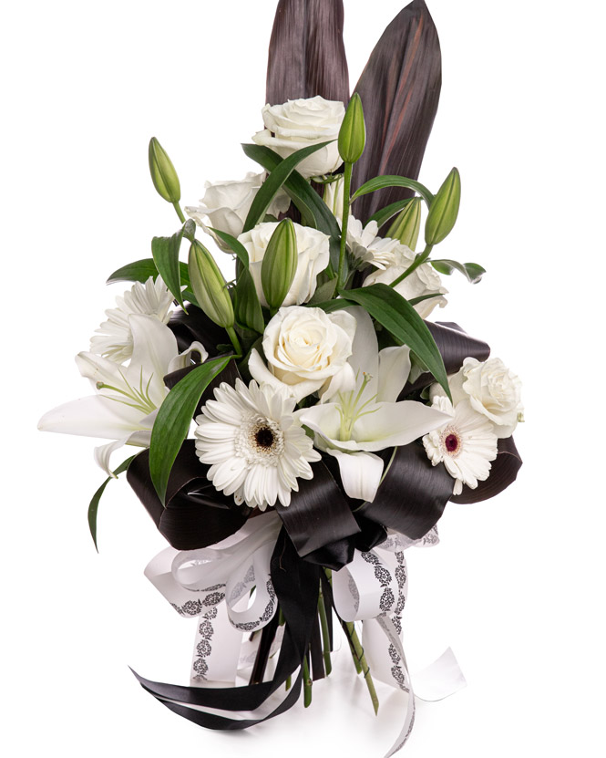 Funeral bouquet with roses, lilies, and gerbera