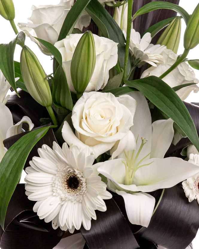 Funeral bouquet with roses, lilies, and gerbera