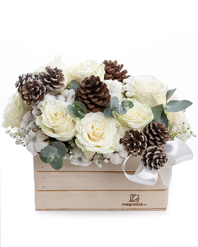 Roses arrangement with winter accessories