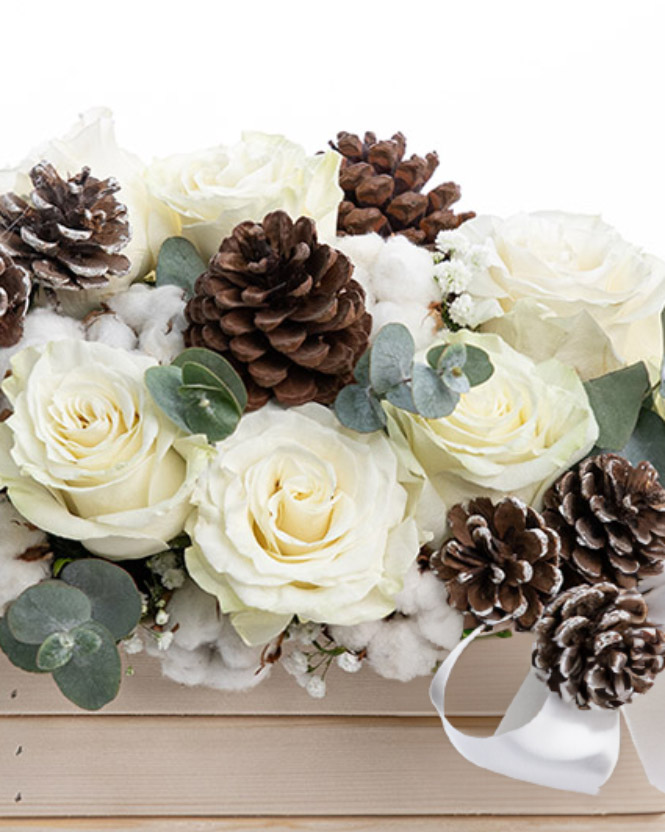 Roses arrangement with winter accessories