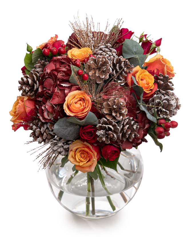 Winter bouquet with roses and pine cone