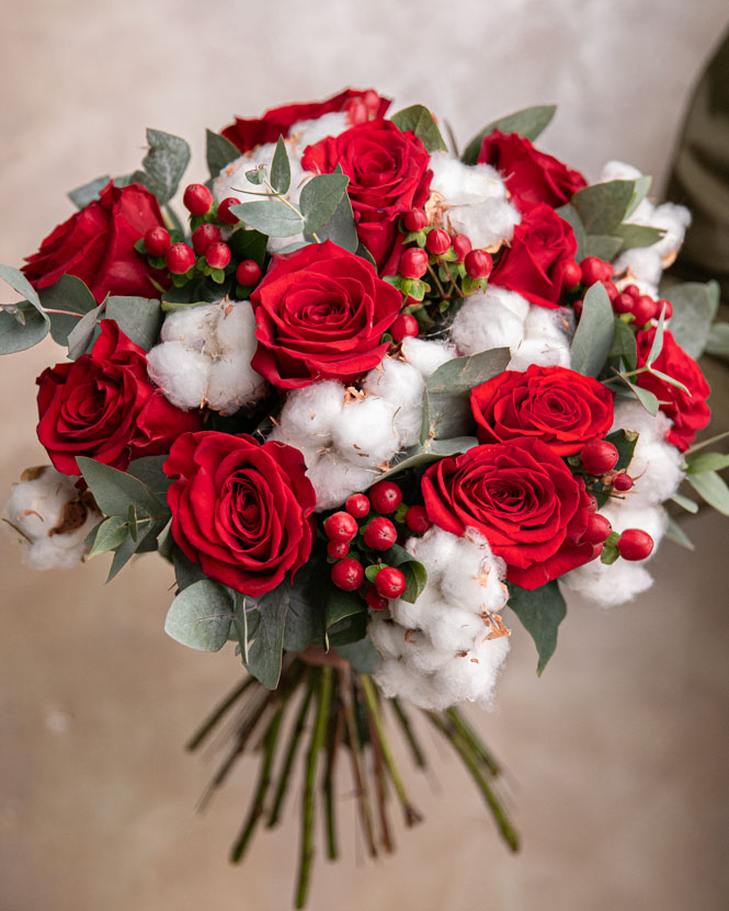 Bouquet of red roses and hypericum