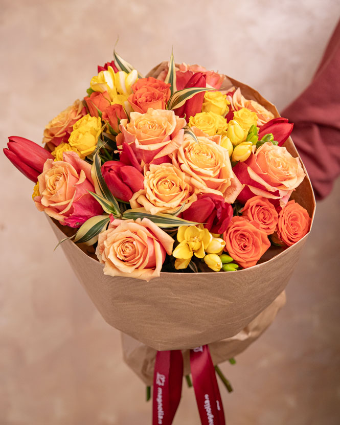 Bouquet of orange roses and red tulips
