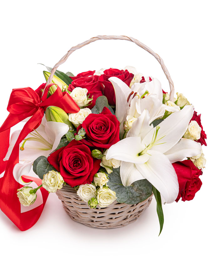 Basket with white lilies and red roses