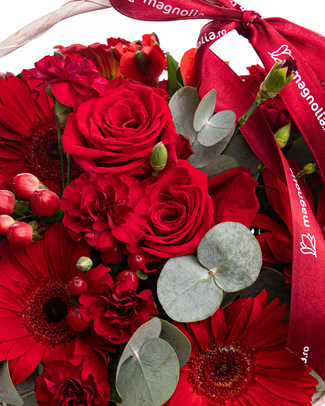 Basket with red gerbera and roses