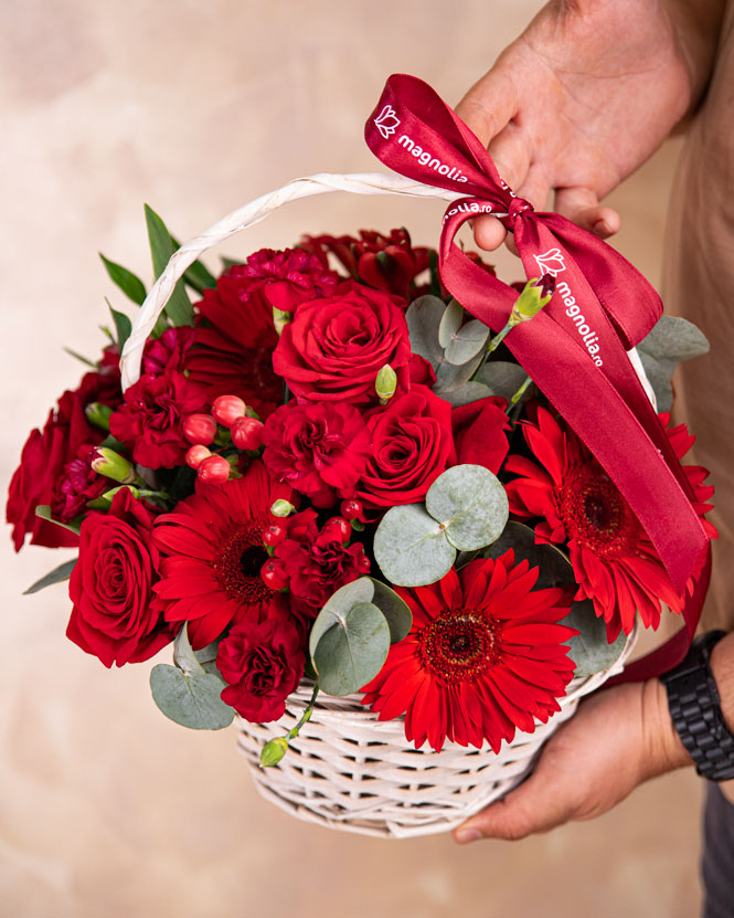 Basket with red gerbera and roses