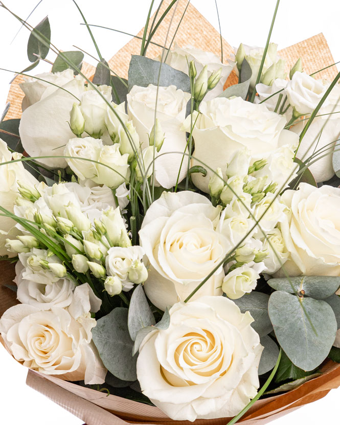 White roses bouquet with eustoma and greenery