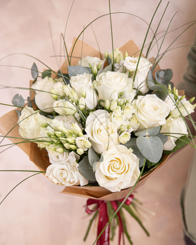 White roses bouquet with eustoma and greenery