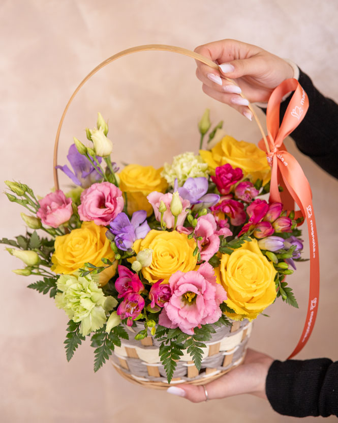 Freesias and roses basket arrangement