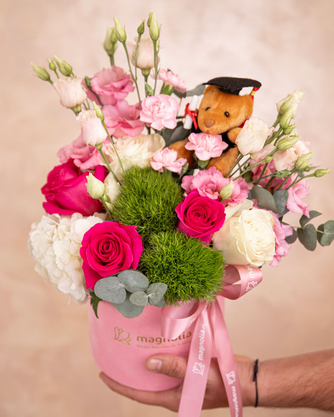 Graduation floral arrangement with roses and accessories
