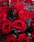 Red roses and limonium bouquet